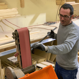 Man operates StoneDog Studios Fabrication Equipment