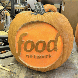 Prop Pumpkin for The Food Network by StoneDog Studios, a foam carving of a punokin with the Food Network logo